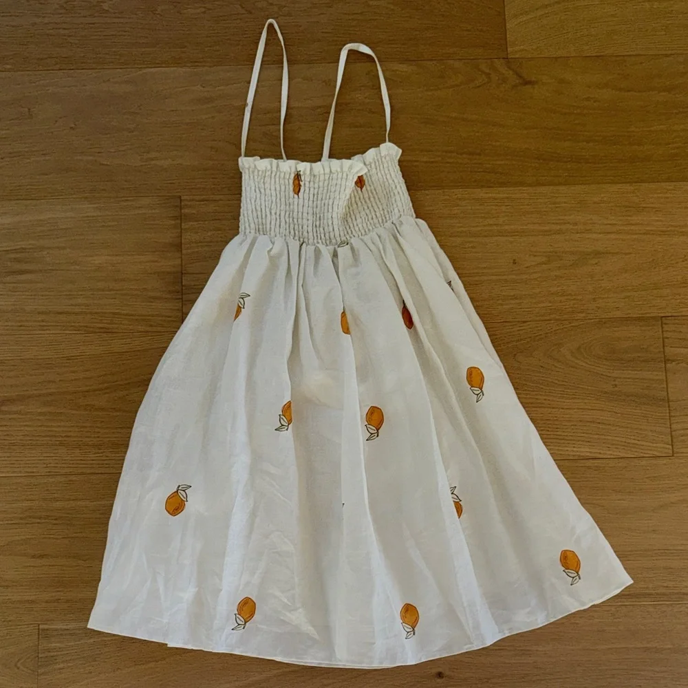 White Smocked Sundress with Orange Fruit Print - Picture 1 of 7
